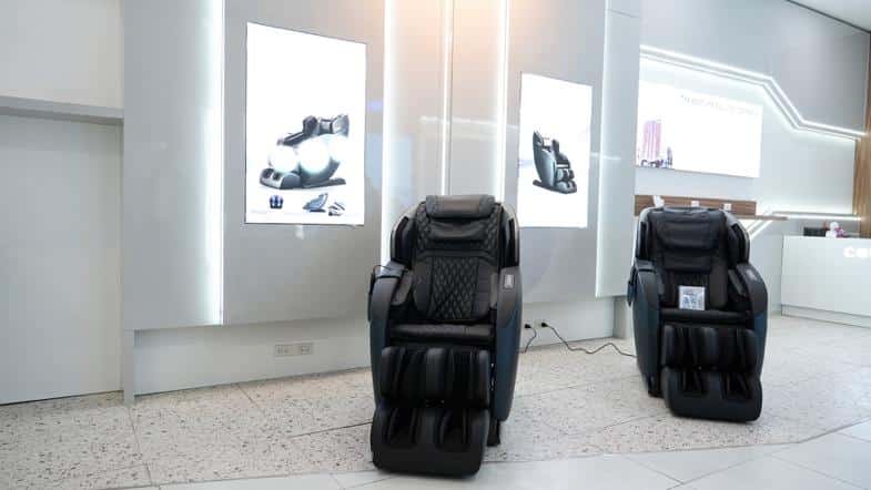 A massage chair in a room
Description automatically generated